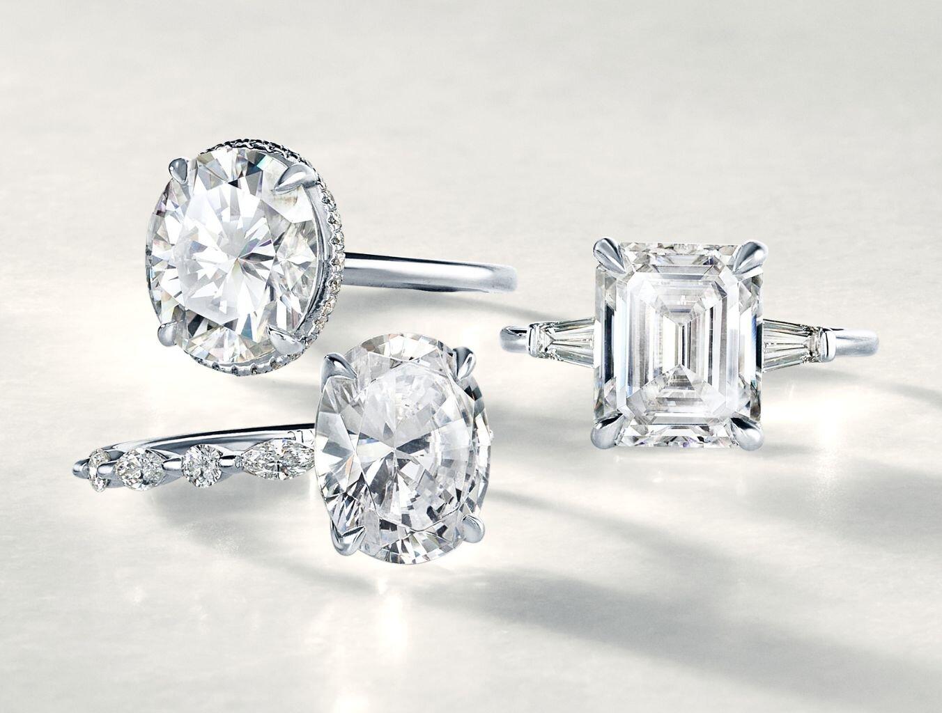 Moissanite engagement rings with different shaped center stones.