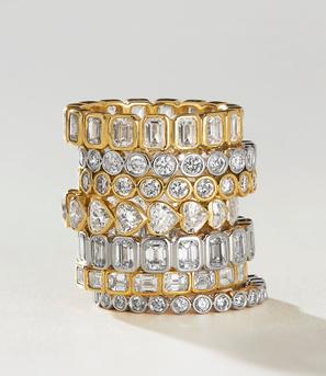 Stack of yellow gold and white gold diamond wedding rings