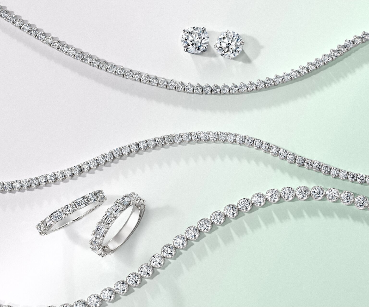 Assortment of white gold diamond fine jewelry.