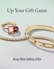 Gold diamond bracelets and gemstone cocktail ring, perfect gifting pieces.